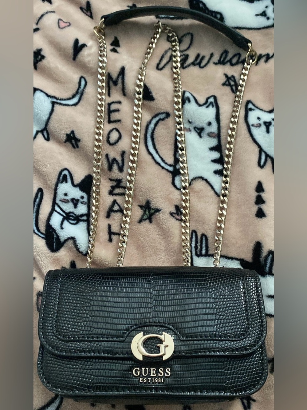 Guess black mini shoulder and crossbody with gold hardware.